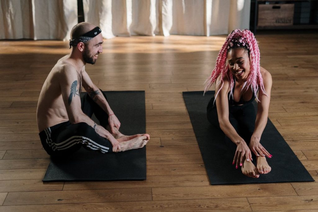Man and Woman Performing Yoga