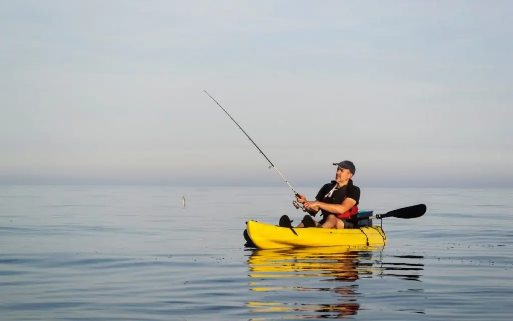 Best Ocean Fishing Kayak - Man Catching a Fish