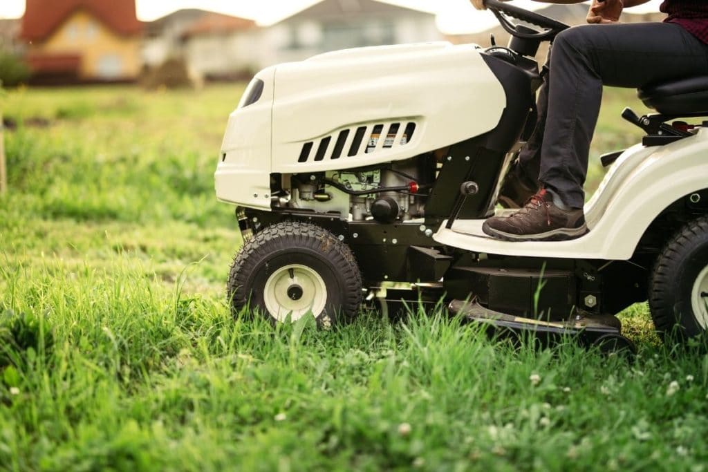 Close-up of someone using a Riding Lawn Mower