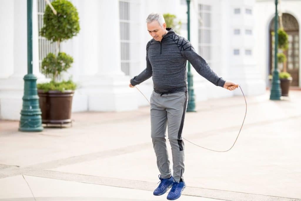 Older Man using Jump Rope for Ease on Knees