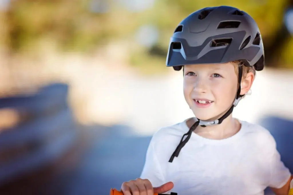 Young child using a well fitting bike helmet